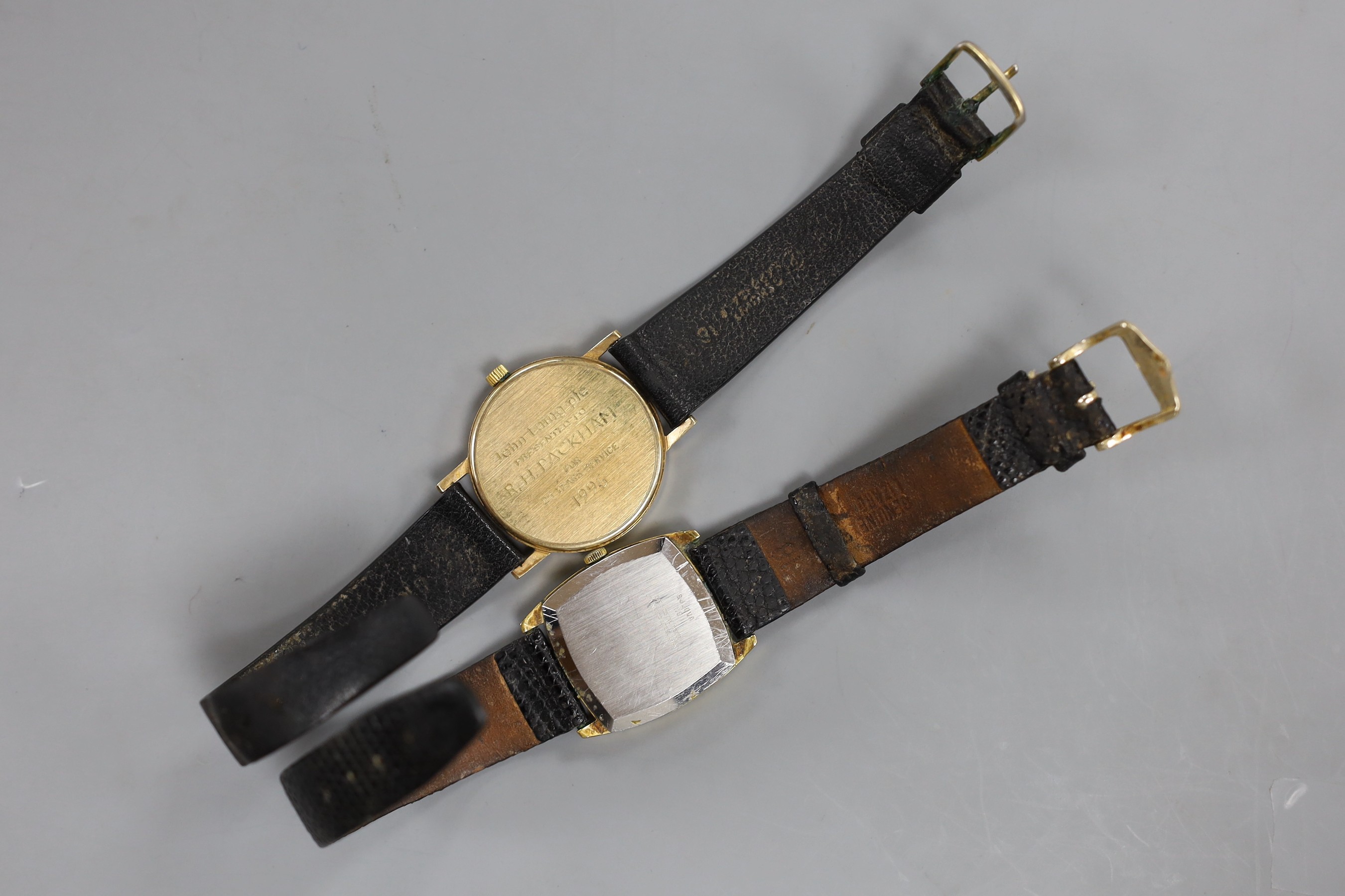 A gentleman's modern gold plated? Garrard quartz wrist watch and a similar steel and gold plated Bulova Accutron quartz wrist watch.